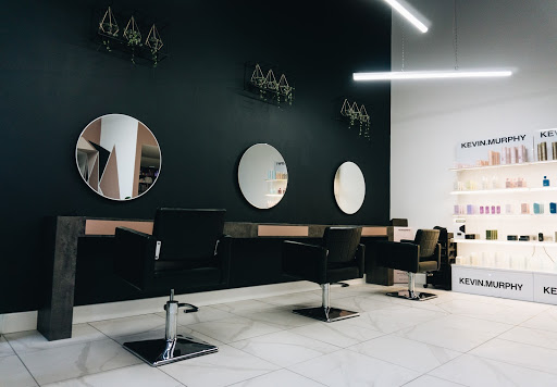 hair salon chairs facing mirrors