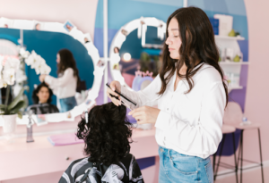 hairdresser cutting customers hair