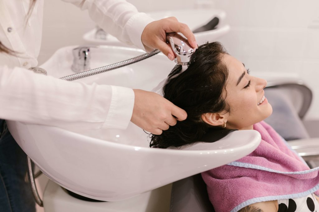 Lady having her hair washed in hair salon