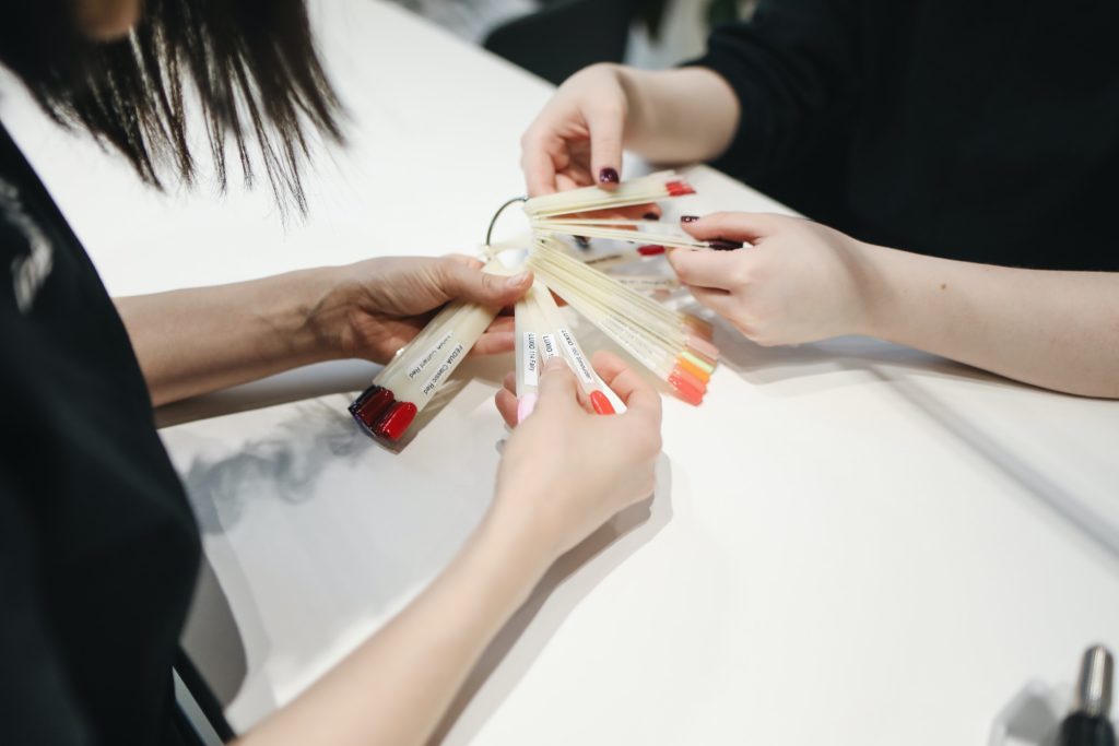 salon worker helping client for good customer satisfaction